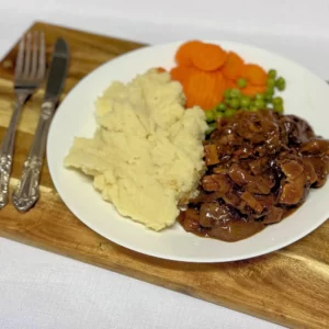 Lambs Fry with mash, carrots, peas