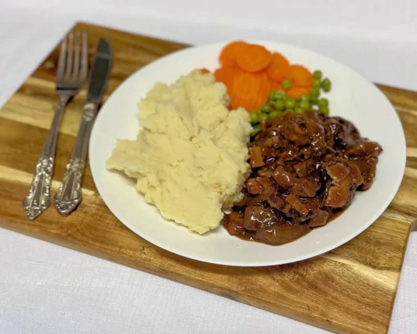 Lambs Fry with mash, carrots, peas